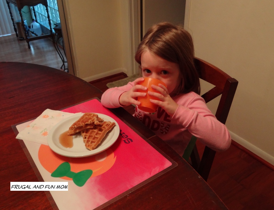 little girl eating breakfast with Silk Fruit and Protein