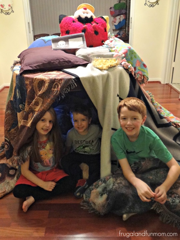 Building a pillow fort with and Pop Secret