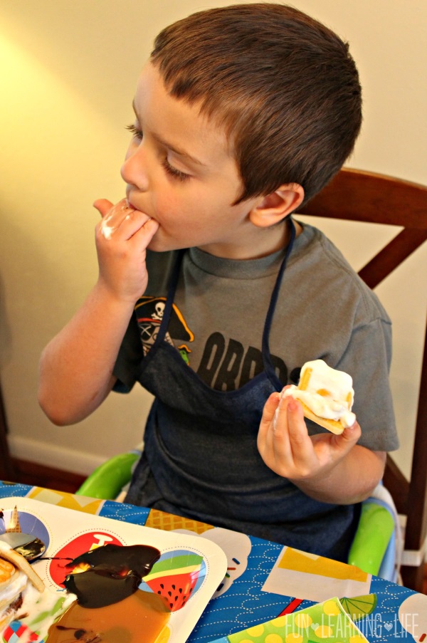 enjoying the cookie stacking game with Pepperidge Farms Chessmen cookies, Smucker’s Simple Delight toppings and Reddi-wip